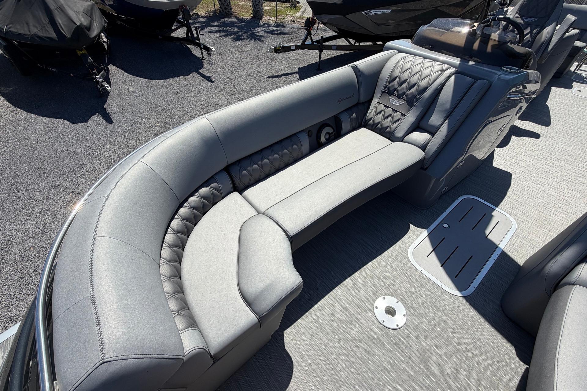 2022 Bennington 25 QX boat interior with luxurious gray seating and modern design.